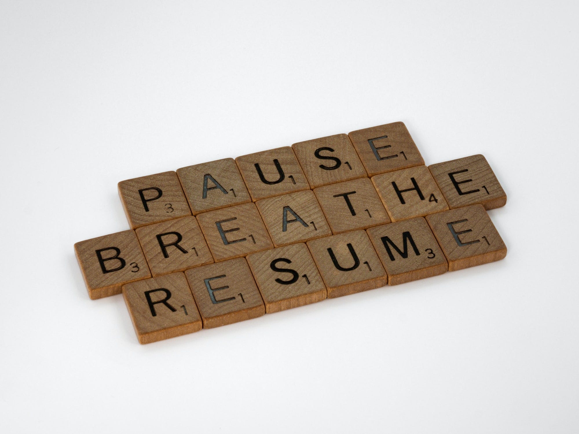 scrabble, scrabble pieces, lettering, letters, wood, scrabble tiles, white background, words, quote, letters, type, typography, design, layout, focus, bokeh, blur, photography, images, image, pause, breathe, resume, pause breathe dream, rest, stop, think, mindfulness, don't rush, focus, reset, redux, reboot, perspective, pace yourself, pace, balance, relax,